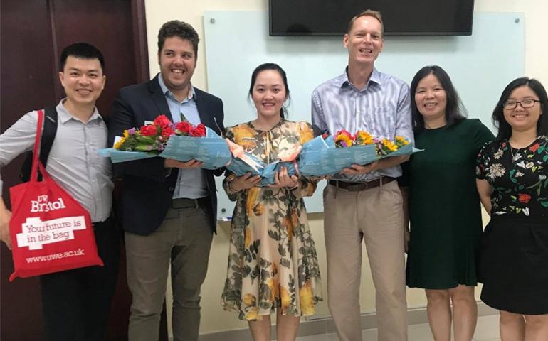 UWE representatives receiving thankful bouquets from TDTU Faculty of Accounting